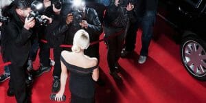 celebrity on a red carpet with the paparazzi