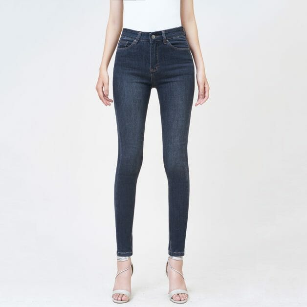 woman wearing high-waisted denim jeans