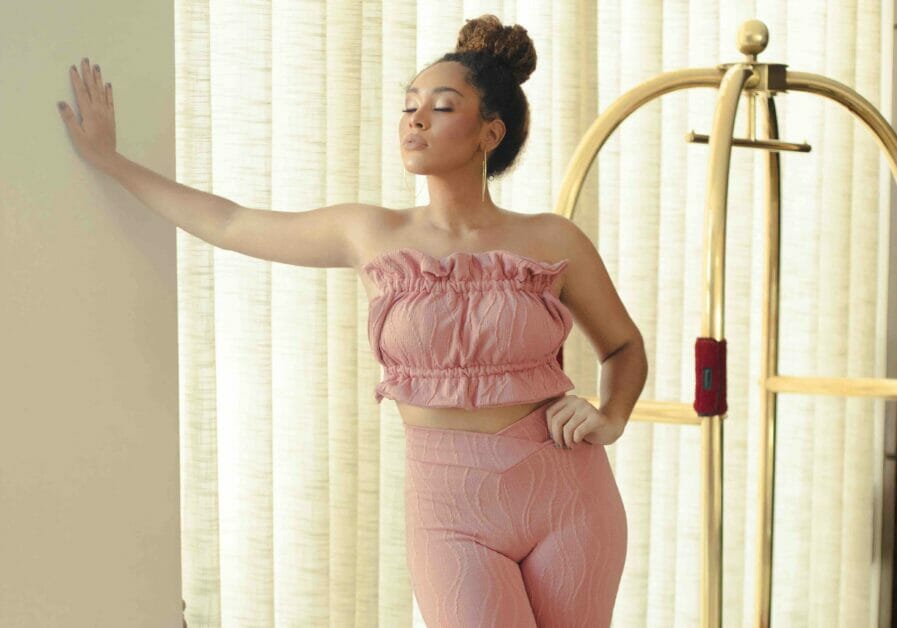 woman in blush coordinates with a curvy body shape