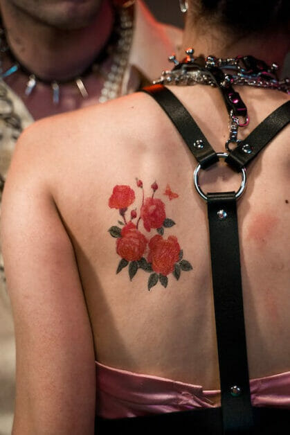 a rose tattoo on the woman's back
