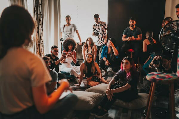 a support group gathering in a room full of people