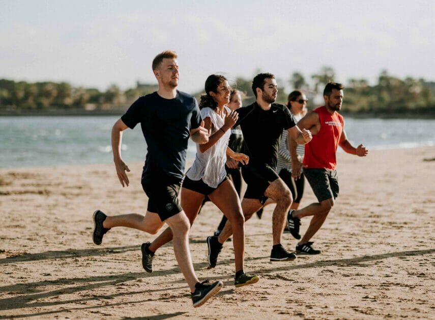 friends running at the beach