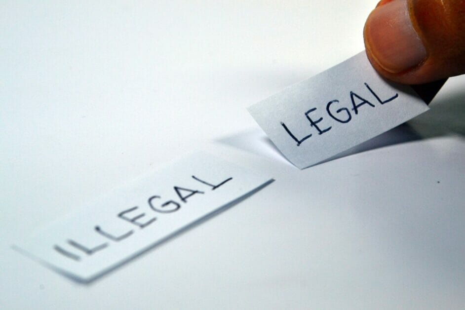 illegal and legal words written on a piece of paper