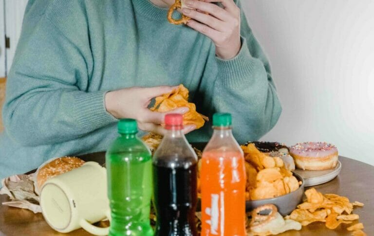 woman eating unhealthy foods and drinks