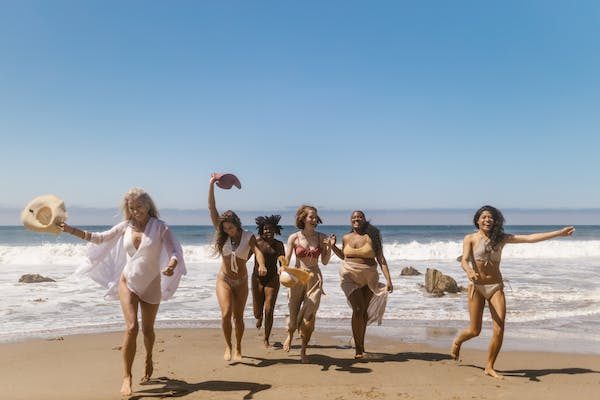 women running on the beach